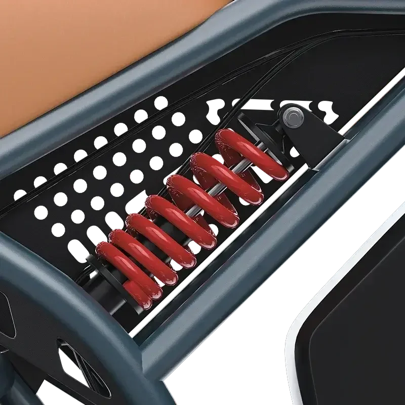 Close-up of red coil spring shock absorber in black and gray electric bike frame